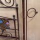 Venetian bed in iron and cast iron from the Art Nouveau period with polychrome decorations