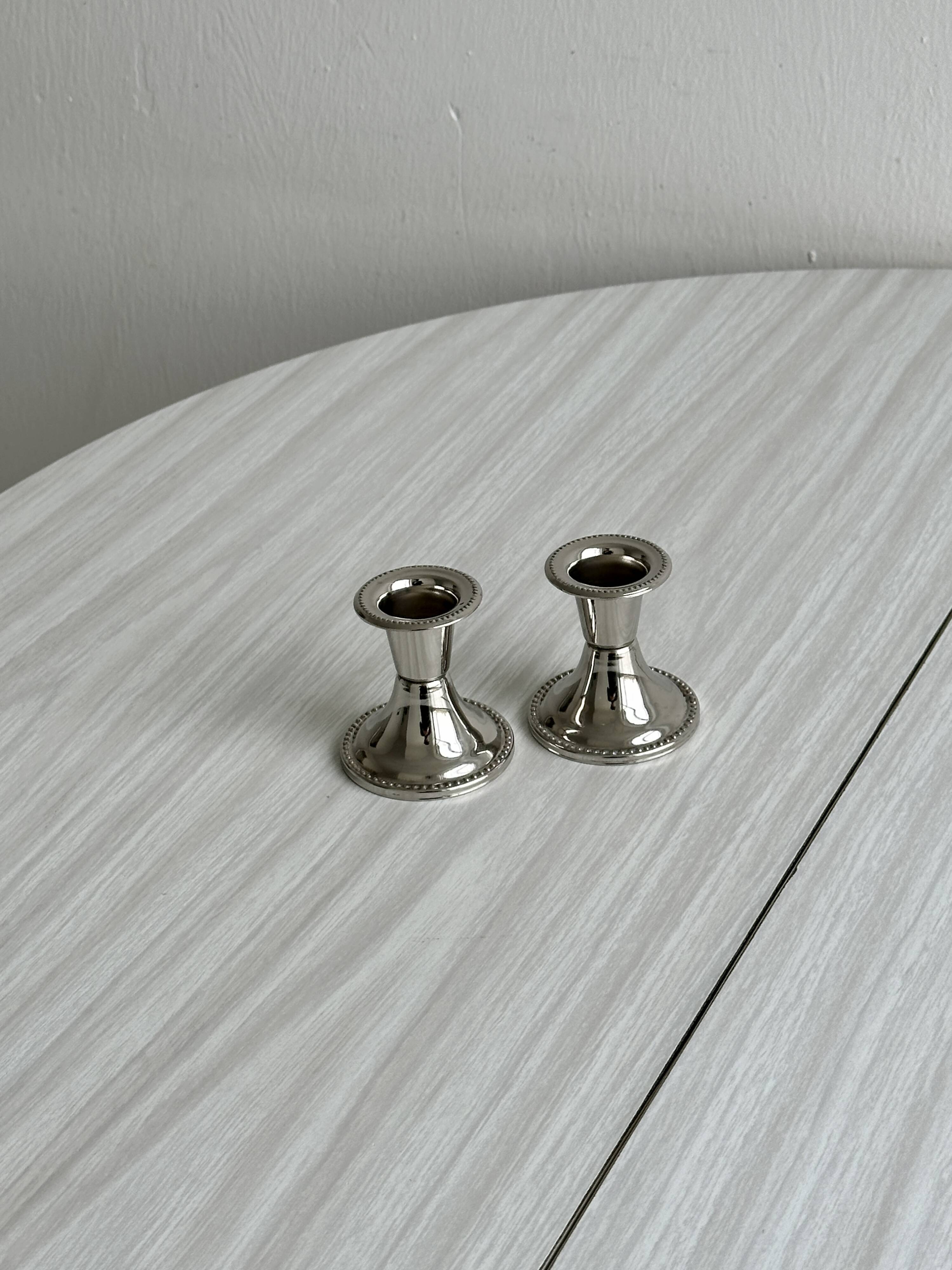 Pair of small, lightweight, beaded metal candle holders