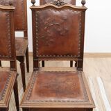 Set of 4 Louis XVI style chairs in carved wood and embossed leather.