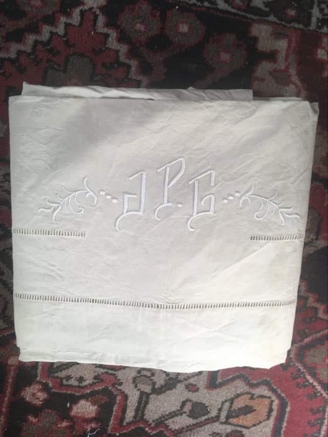 Mixed-race sheet with JPG monogram.