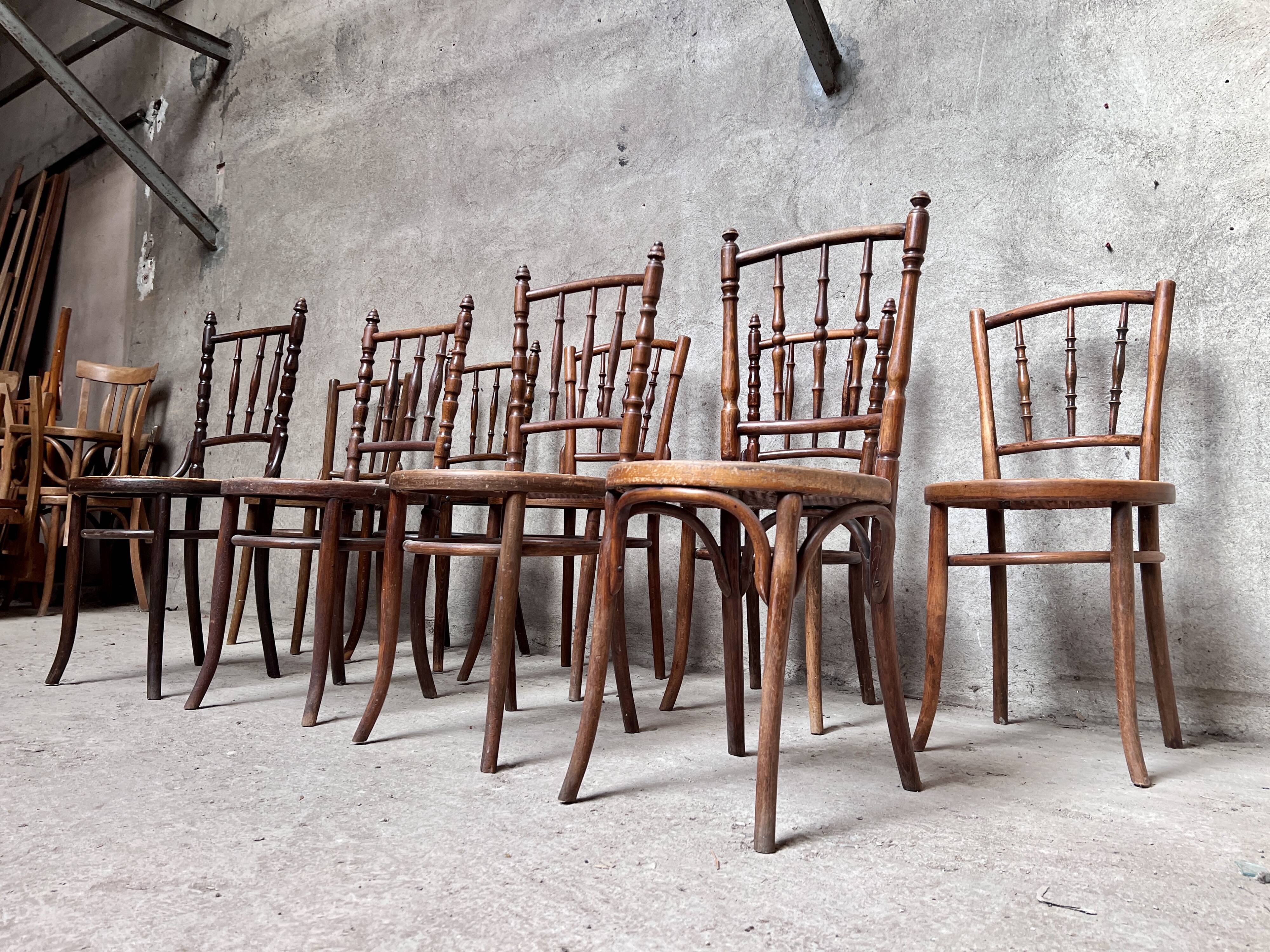 Series of 7 old bar cane cane bistro chairs