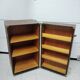 Wardrobe trunk on casters in mahogany and woven rattan.