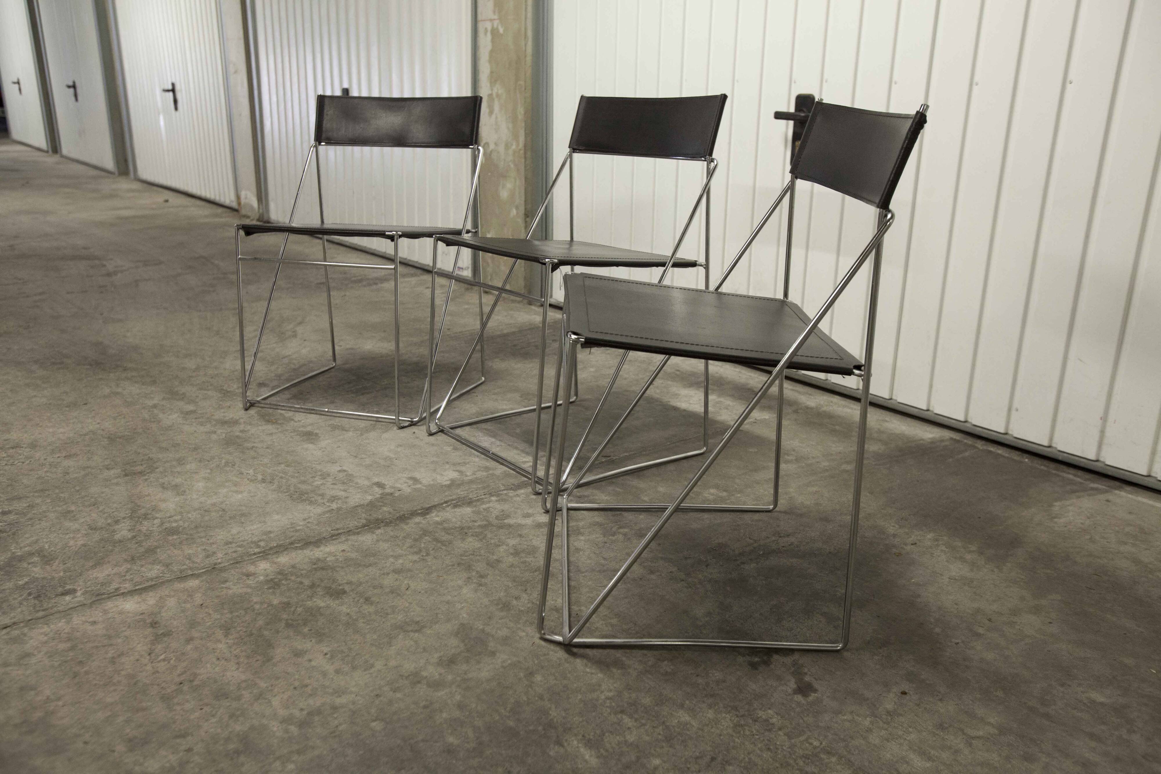 Set of 3 minimalist X line chairs by Niels Jorgen Haugesen.
