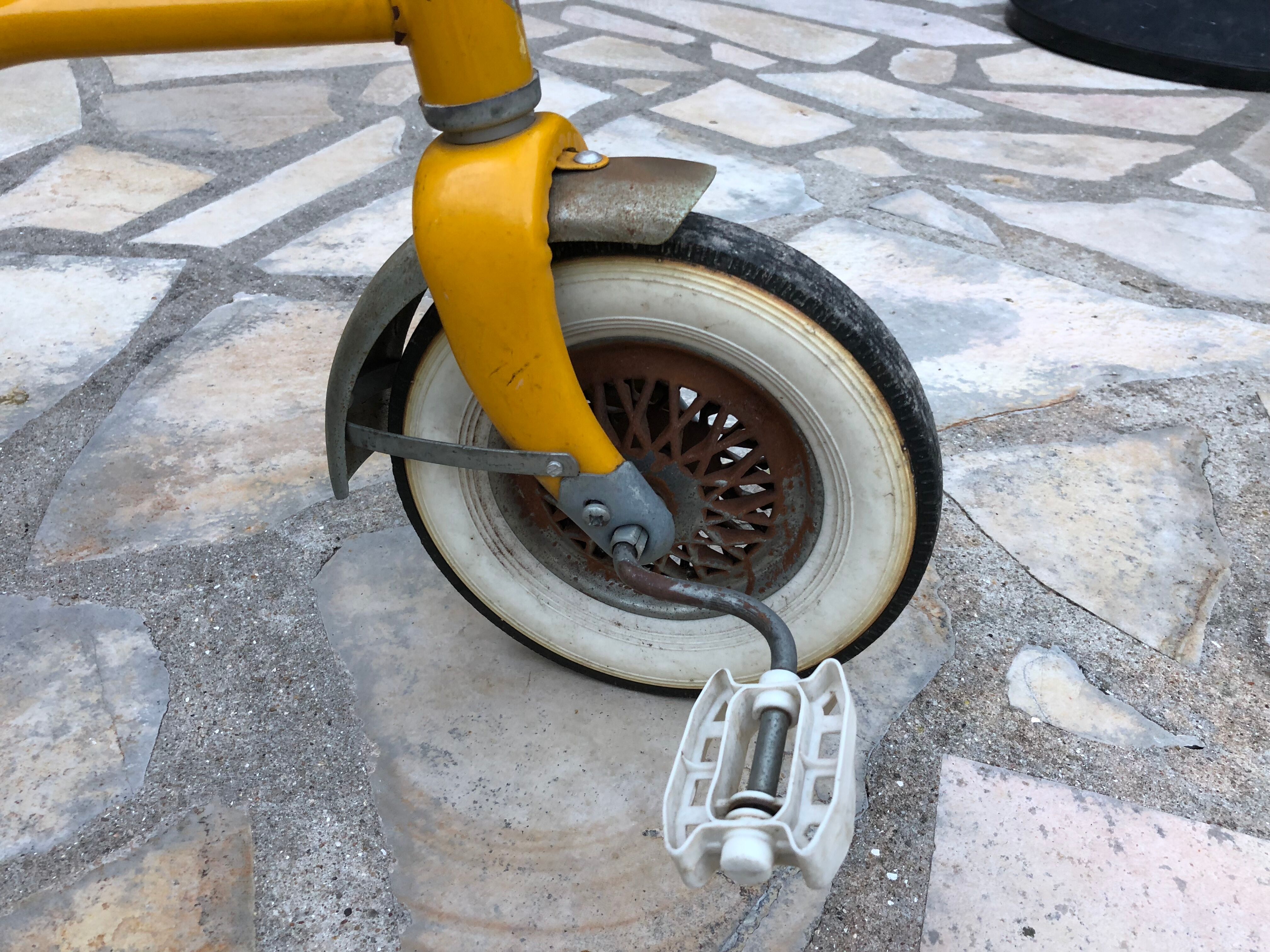 Yellow tricycle with folding bucket