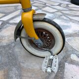Yellow tricycle with folding bucket