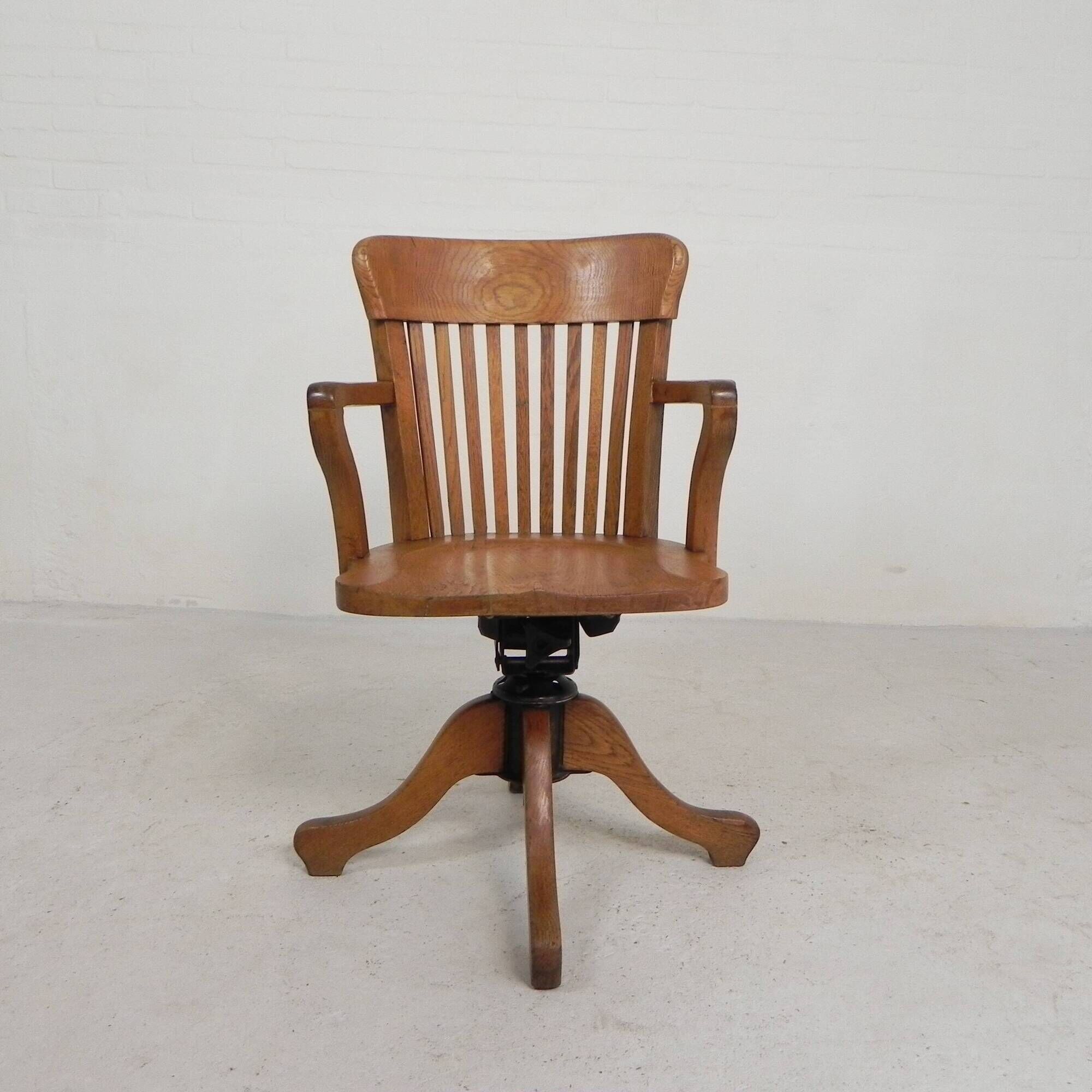 Oak office chair with adjustable spring system and height adjustment, 1950s.