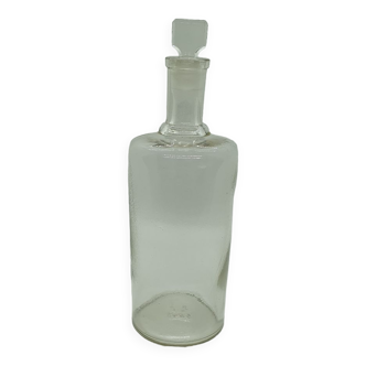 Old apothecary bottle with its cap