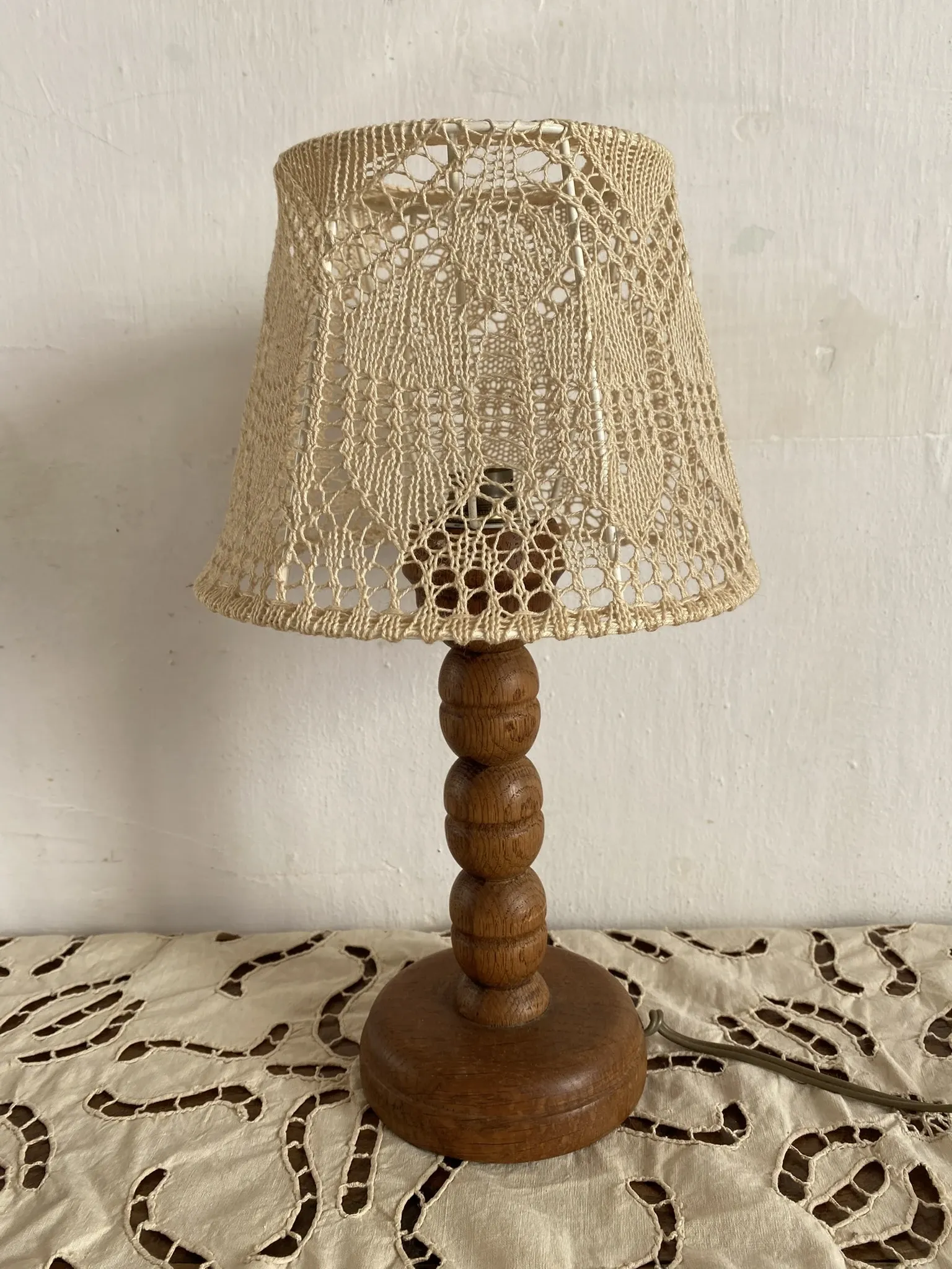 Wooden turned bedside lamp with lace