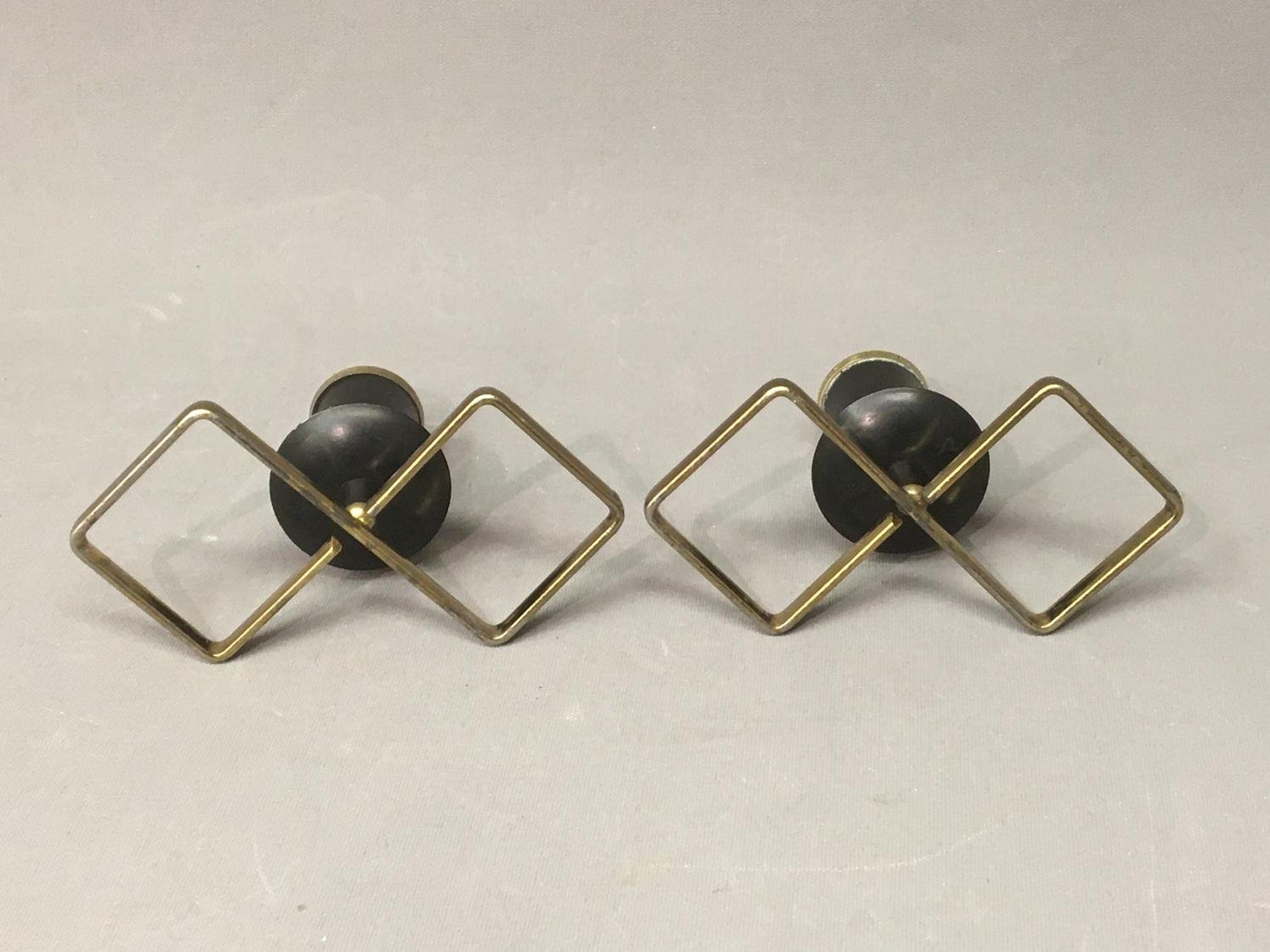 Pair of vintage candle holders in black metal and brass Sweden 1960