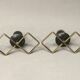 Pair of vintage candle holders in black metal and brass Sweden 1960