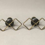 Pair of vintage candle holders in black metal and brass Sweden 1960
