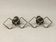 Pair of vintage candle holders in black metal and brass Sweden 1960