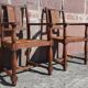 Pair of oak armchairs with straw seats and backs.