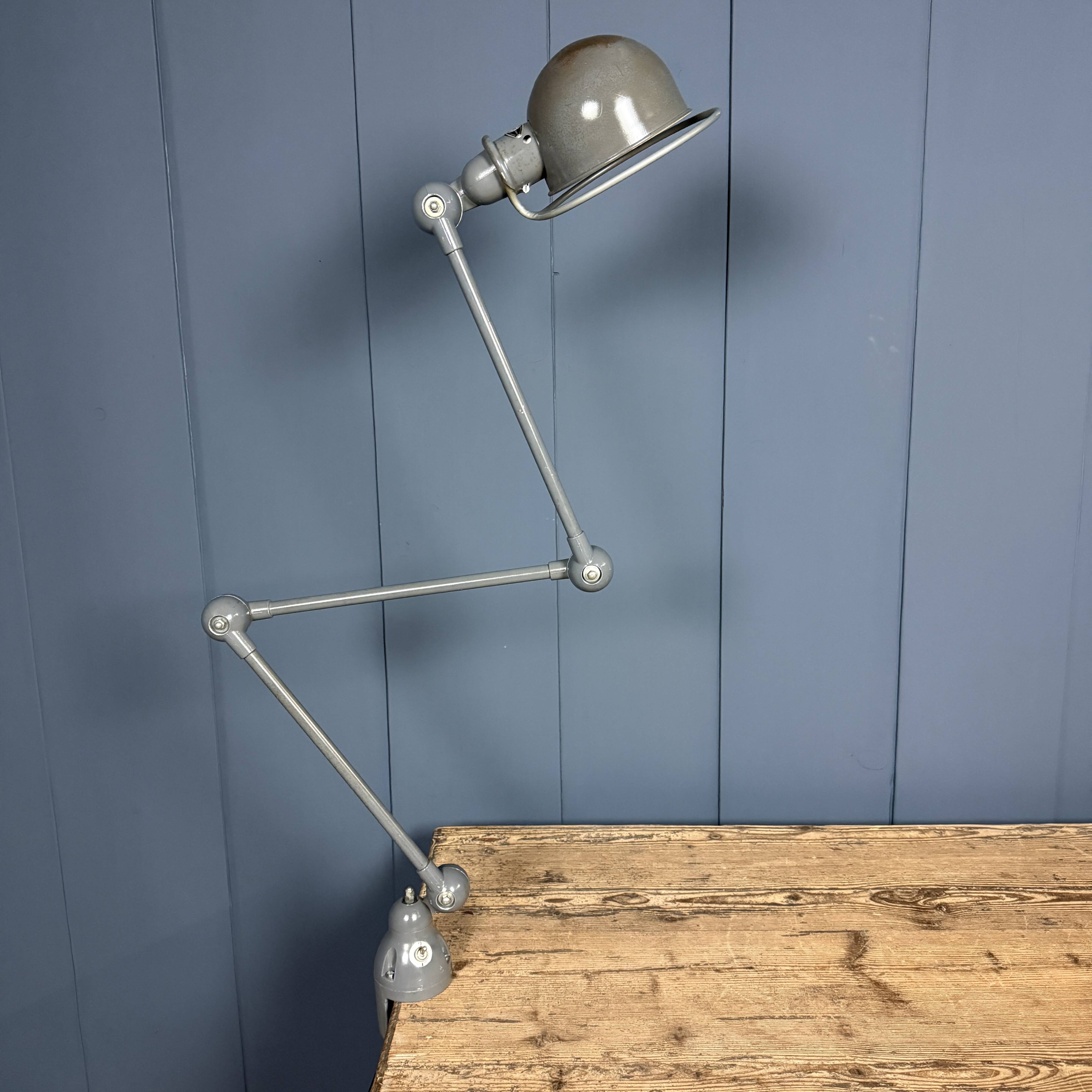 Dark grey Jielde three-arm clamp table lamp