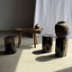 Black petrified wood side table with beige stripes, star pattern H35 D24.