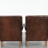 Set of two characterful sheepskin armchairs with a beautiful deep colour