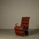 Pair of sculptural cognac leather armchairs, 1970s