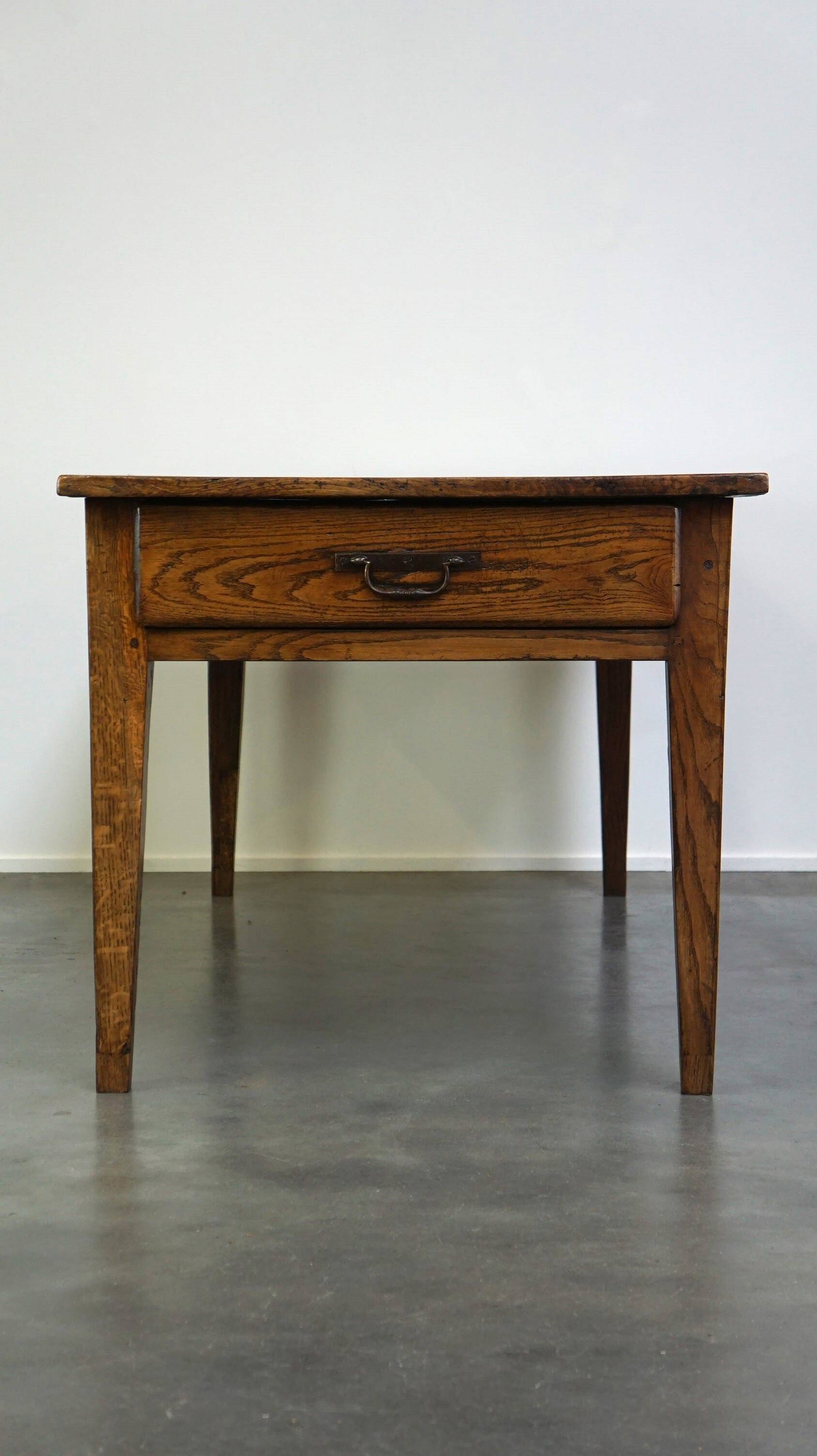 antique French oak dining table with 3 drawers and an exquisite patina