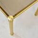 Table basse italienne du milieu du siècle en laiton tubulaire et verre fumé. Rétro.