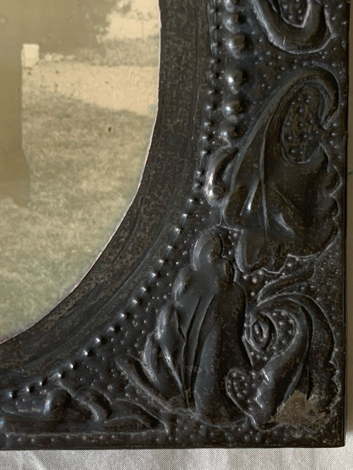 Old photo holder frame in vintage chiseled pewter