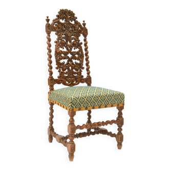 Richly carved wooden back chair