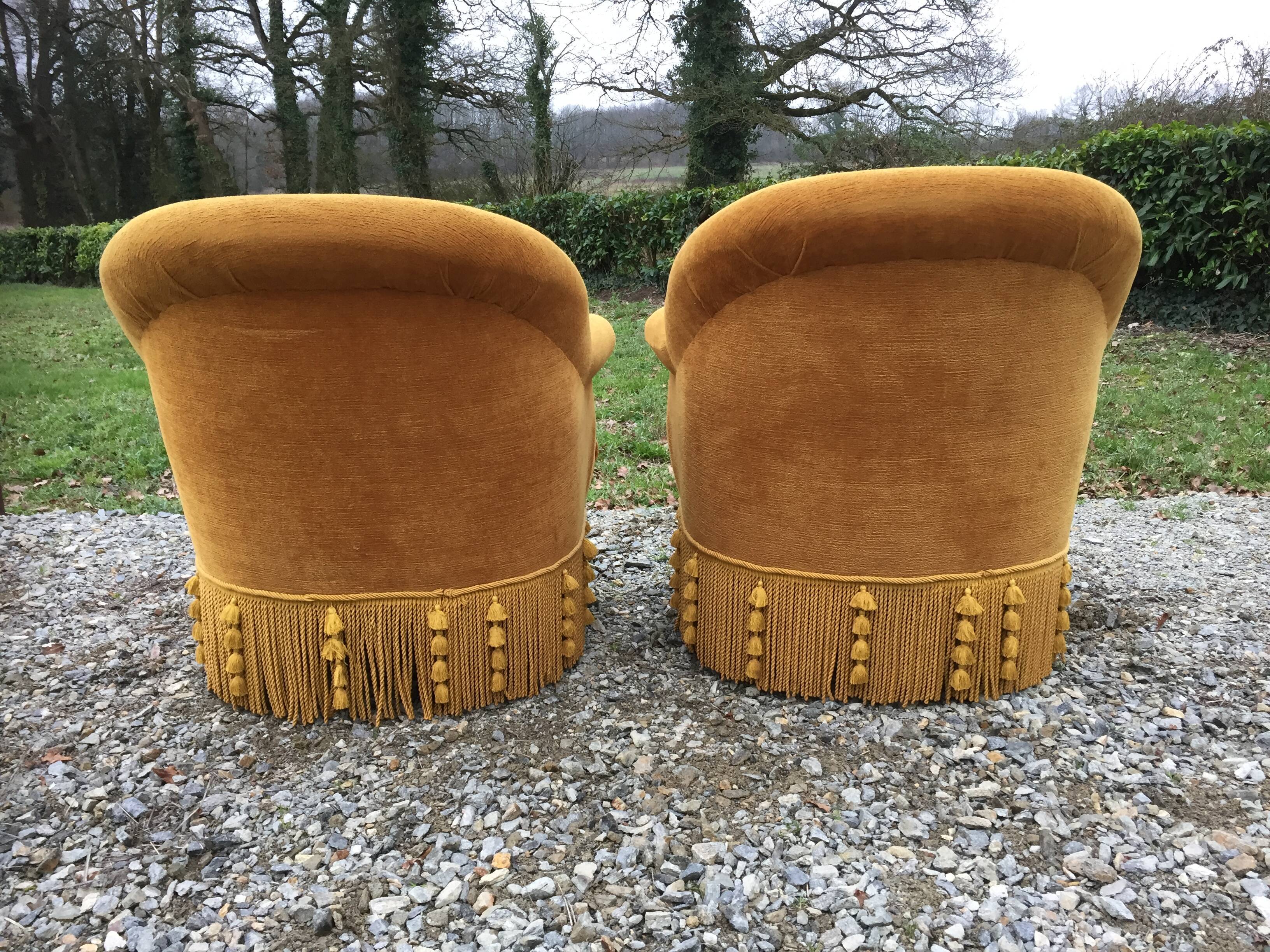 Duo de fauteuils vintage crapaud en tissu or