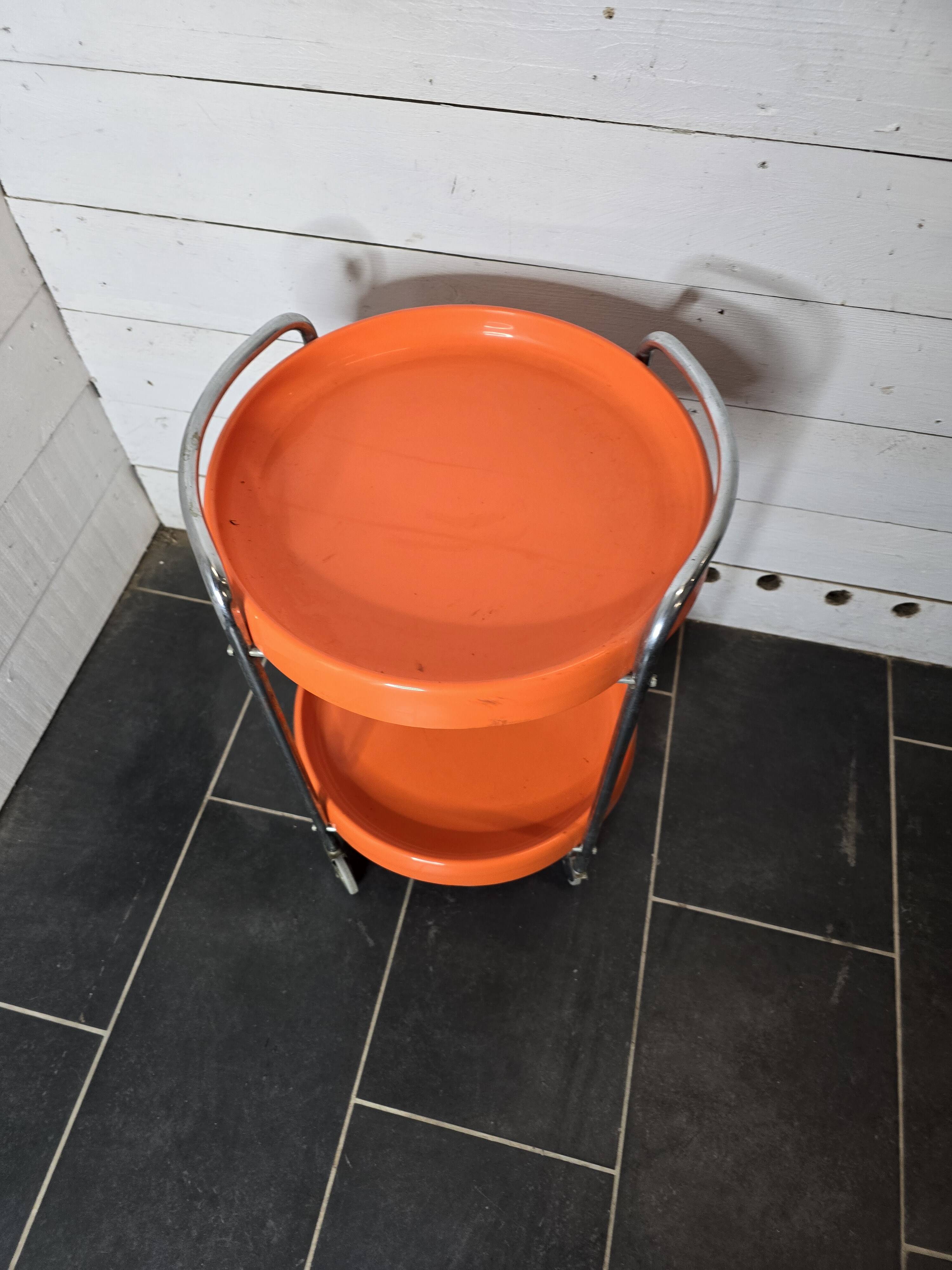 Orange trolley on wheels from the 70s