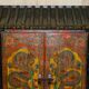 Vintage Chinese wardrobe painted with pagoda and drawers.