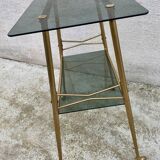 Vintage 1970s glass and gold rolling console table.