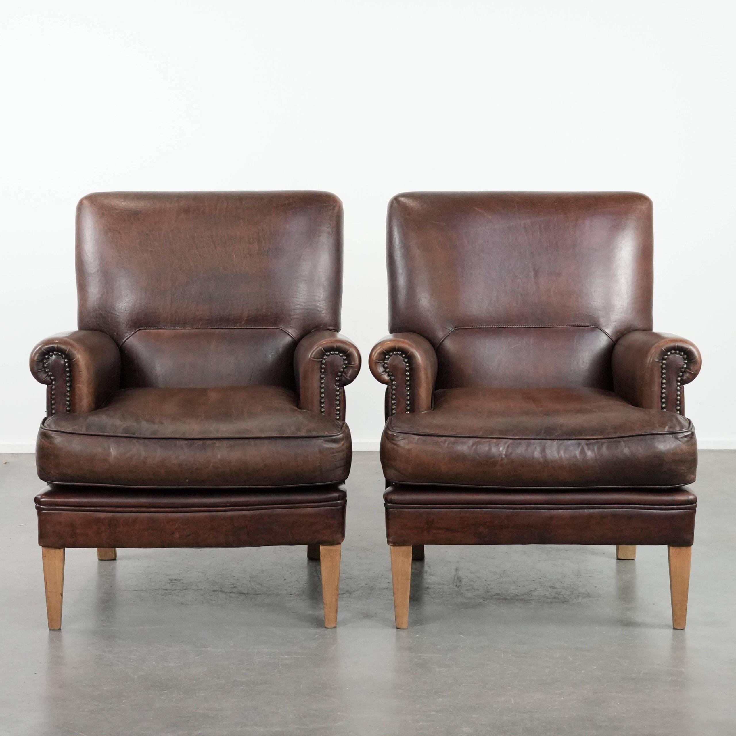 Set of two characterful sheepskin armchairs with a beautiful deep colour