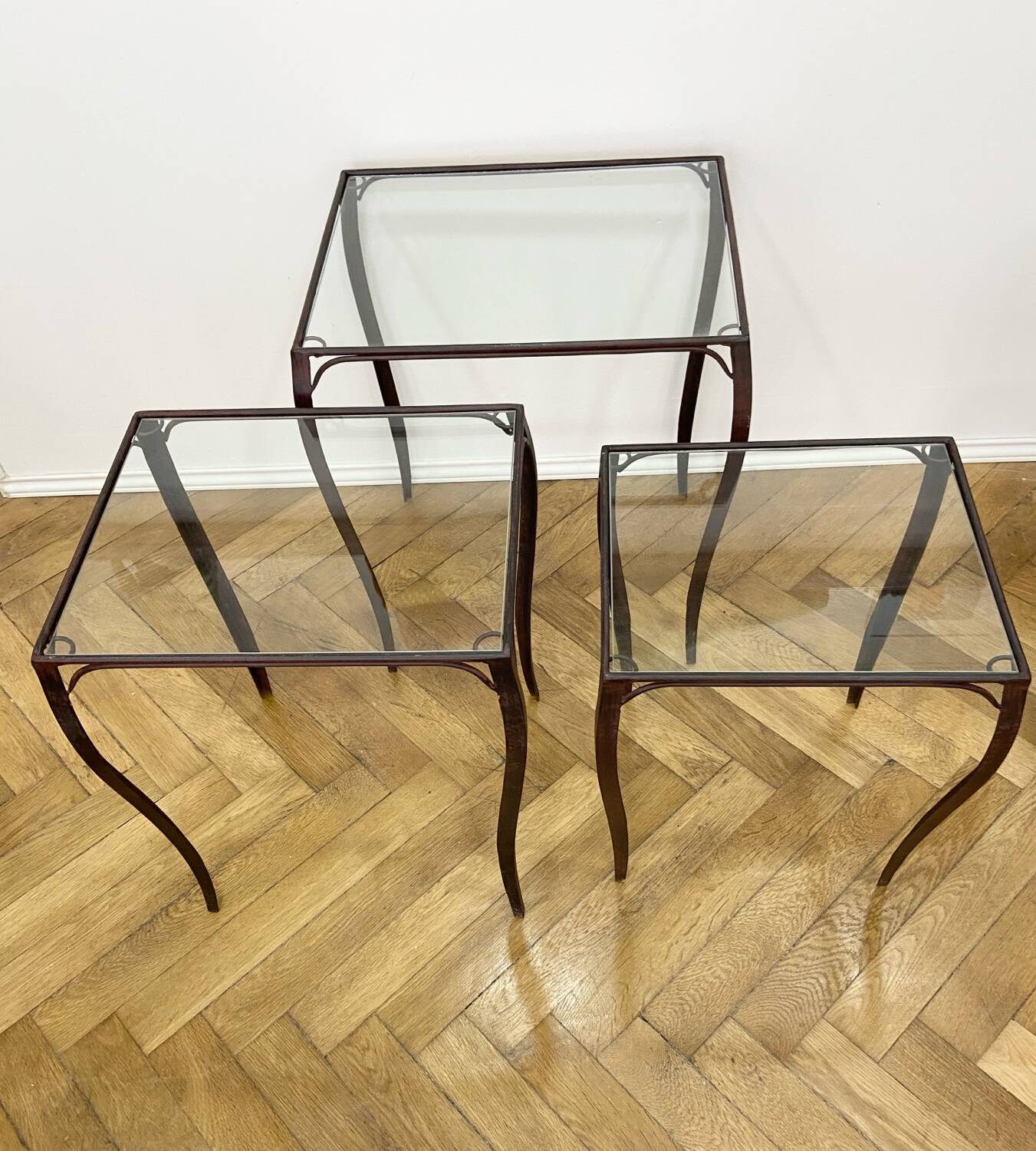 Nesting tables in wrought iron and glass