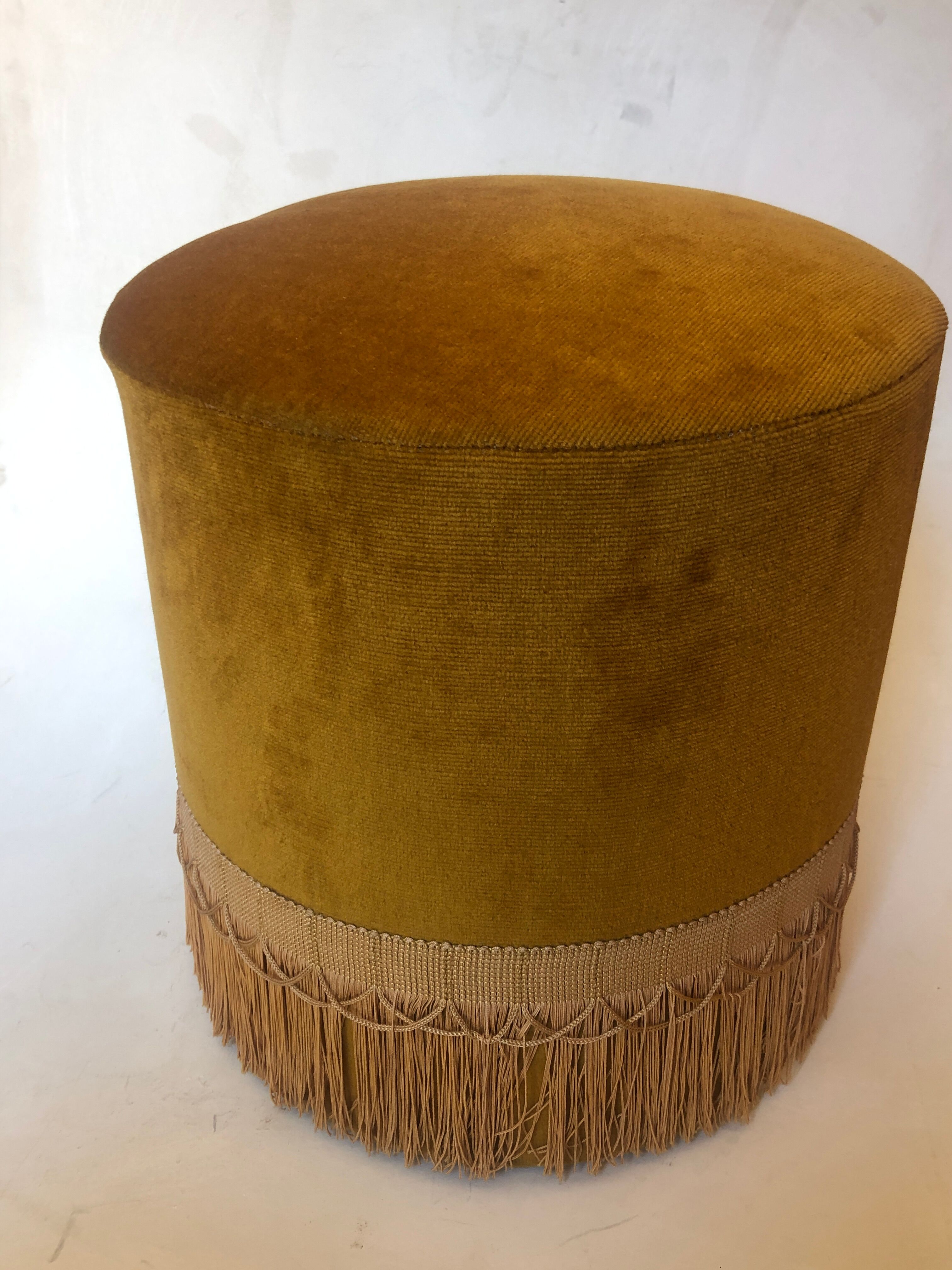 Velvet and fringed ottoman