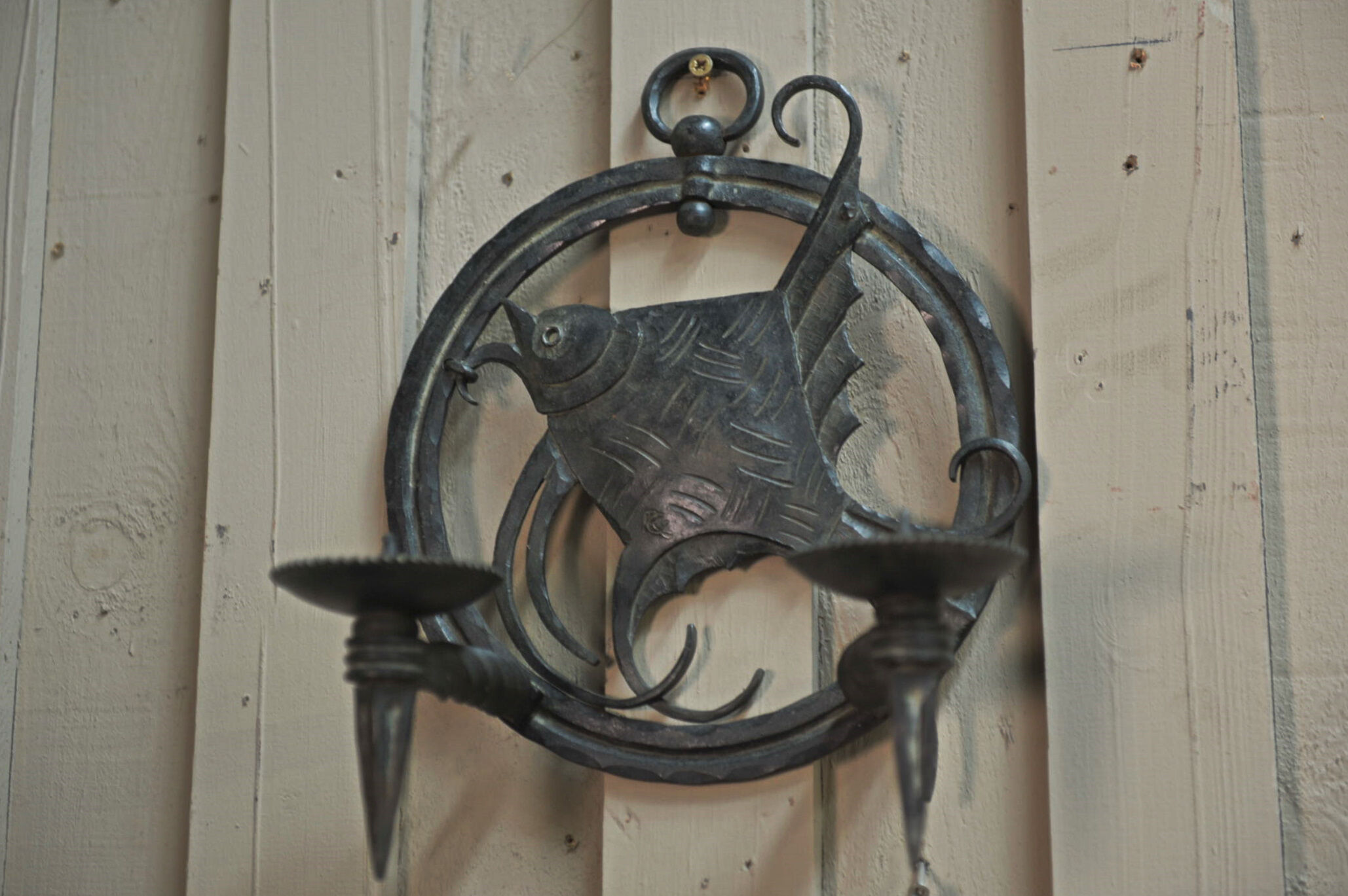 Pair of carved metal wall lamps signed RG