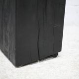 Brutalist chair, black-stained raw wood, steel. Work from the 1970s