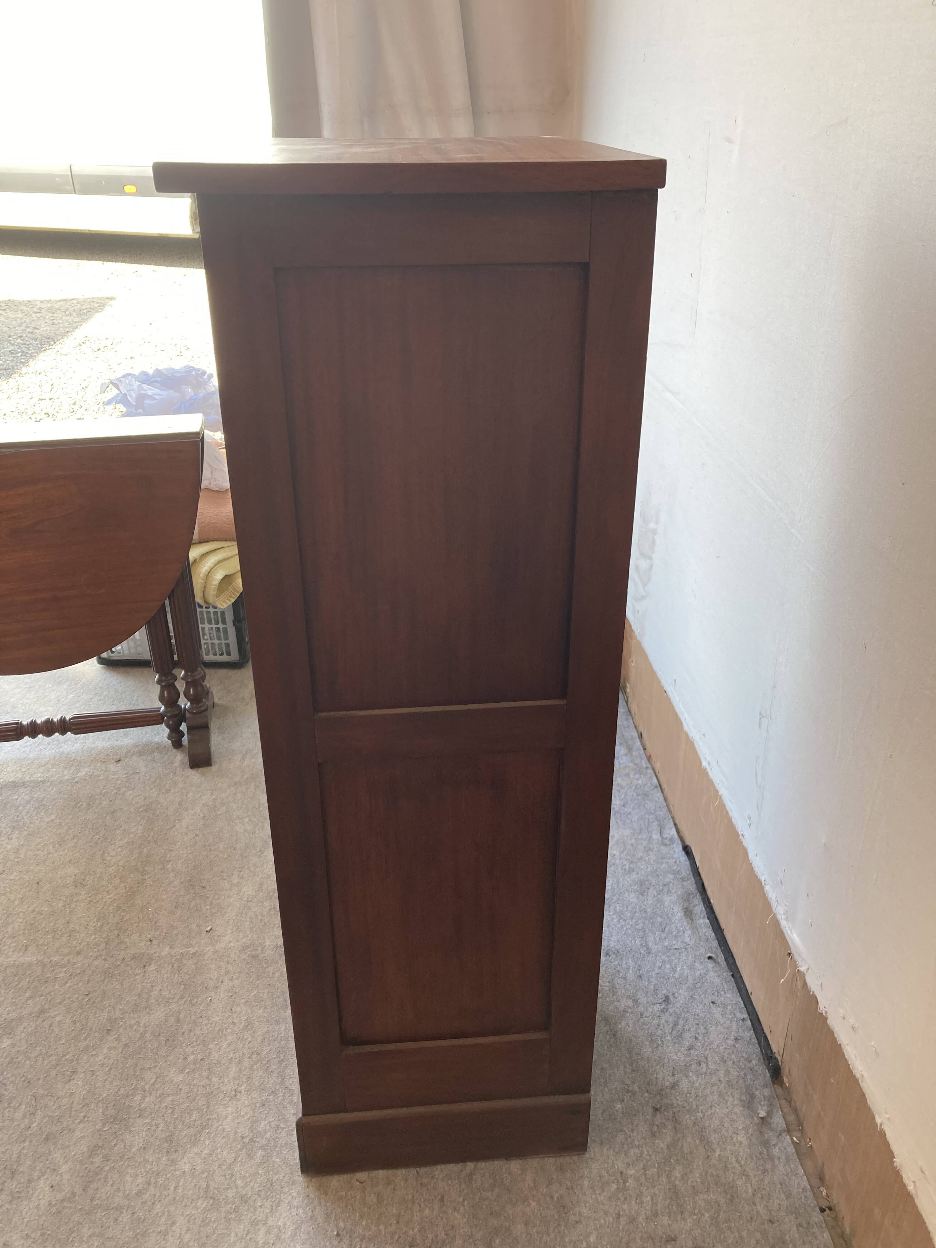 Small curtain filing cabinet.