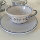 Glazed earthenware cups and saucers