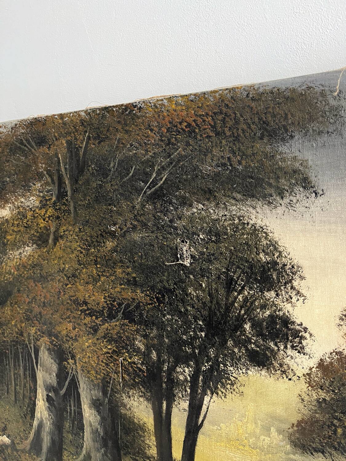 Old oil painting on canvas of a forest landscape.