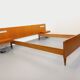 Double bed in vintage Scandinavian style from the 1960s with bedside tables.