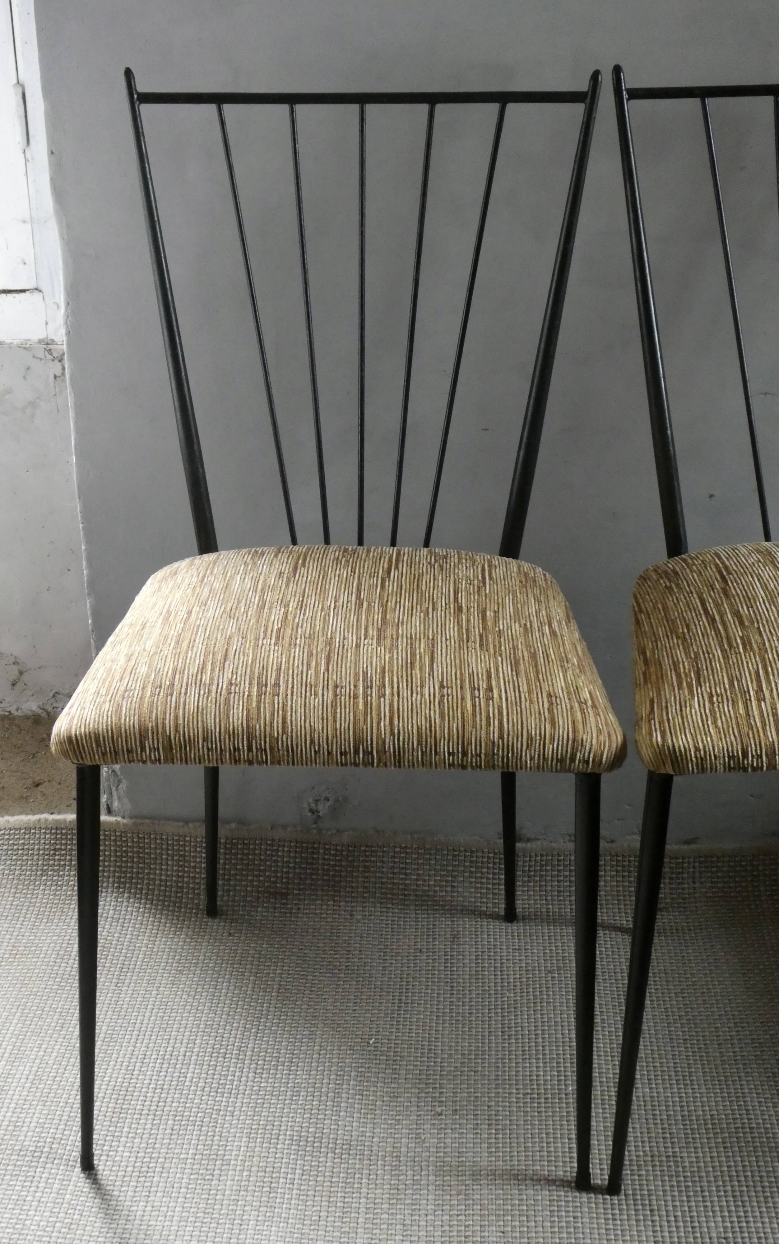 Pair of Colette Gueden chairs, black metal and fabric.