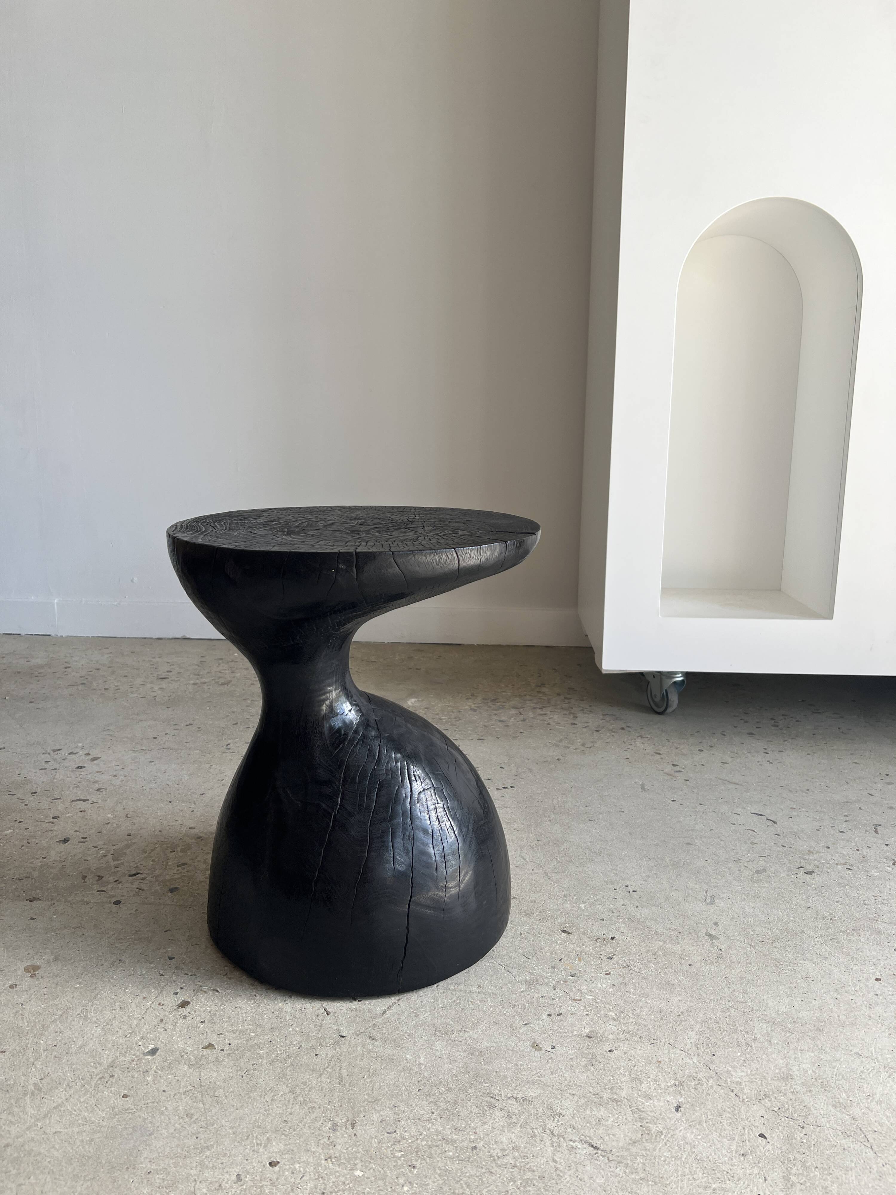 Solid wood (monoxyl) side table, organic shape, black color