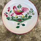 Old plate with flower and rooster pattern