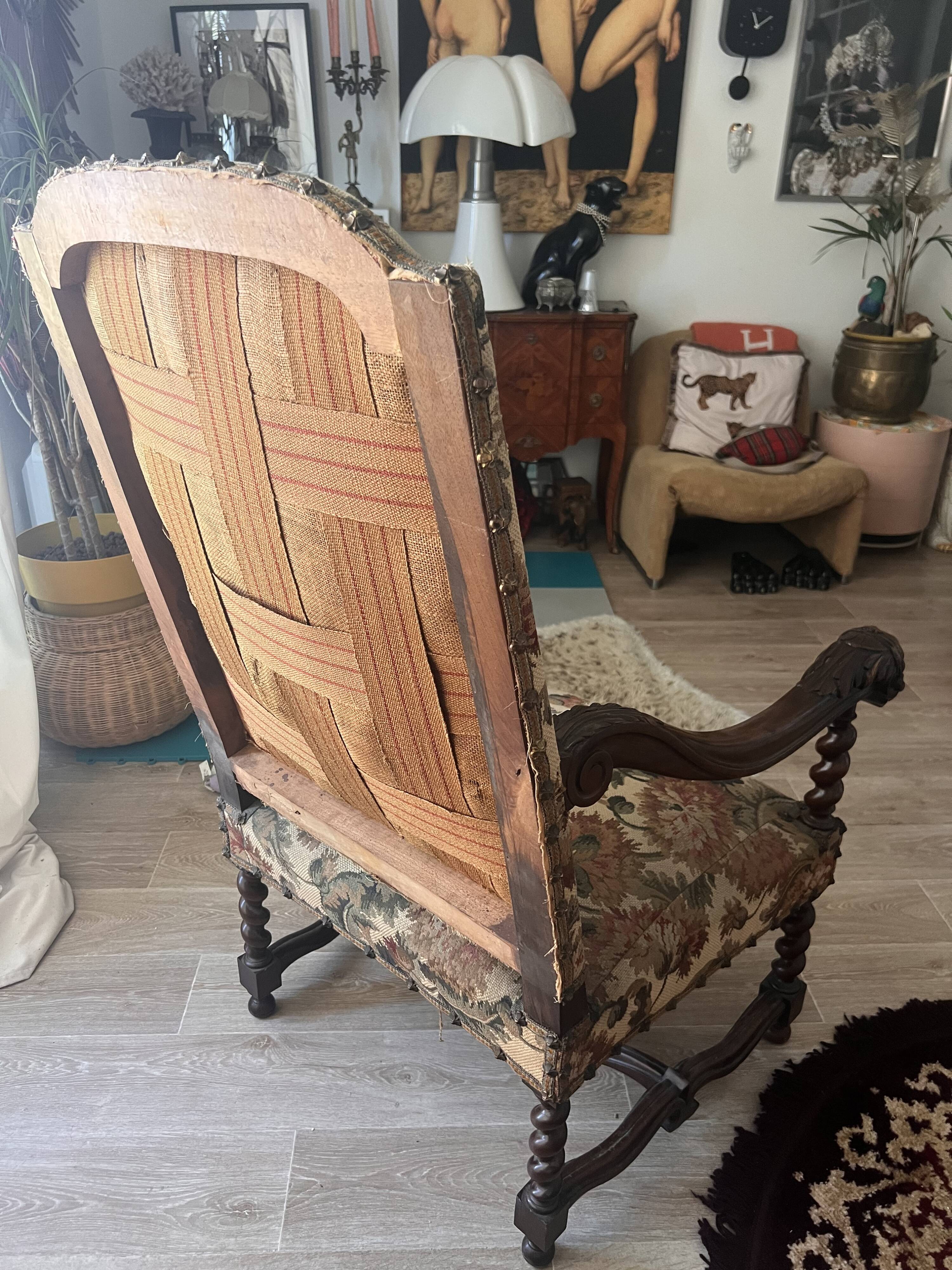 Antique armchair in Henri II style with masks