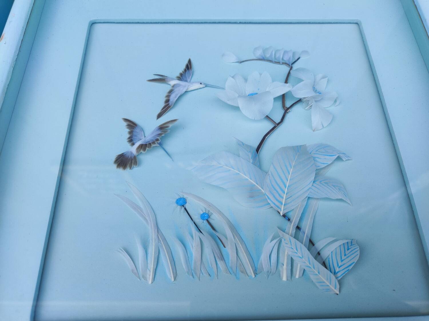 Two vintage paintings made with feathers, hummingbird motif