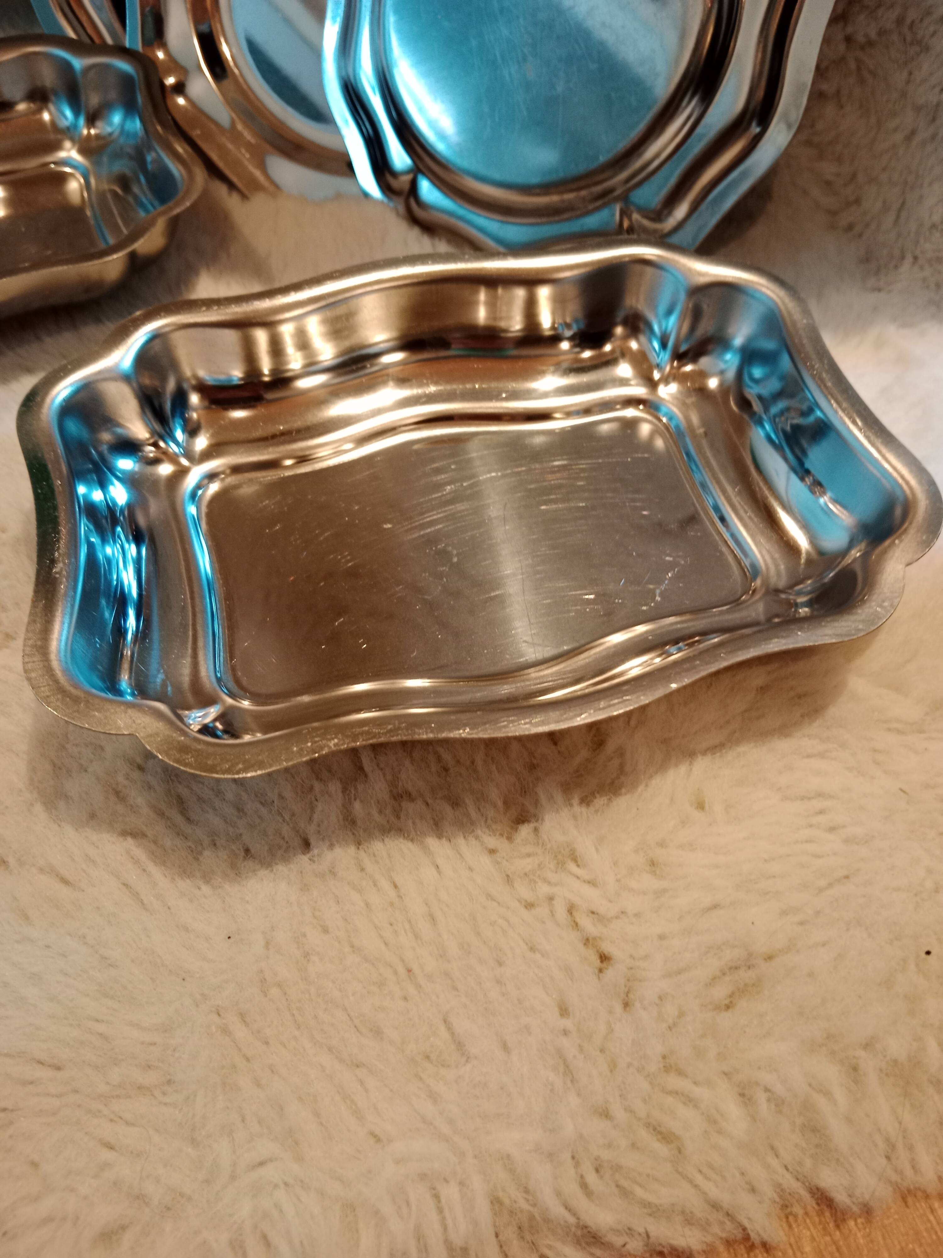 Set of vintage stainless steel mini dishes.