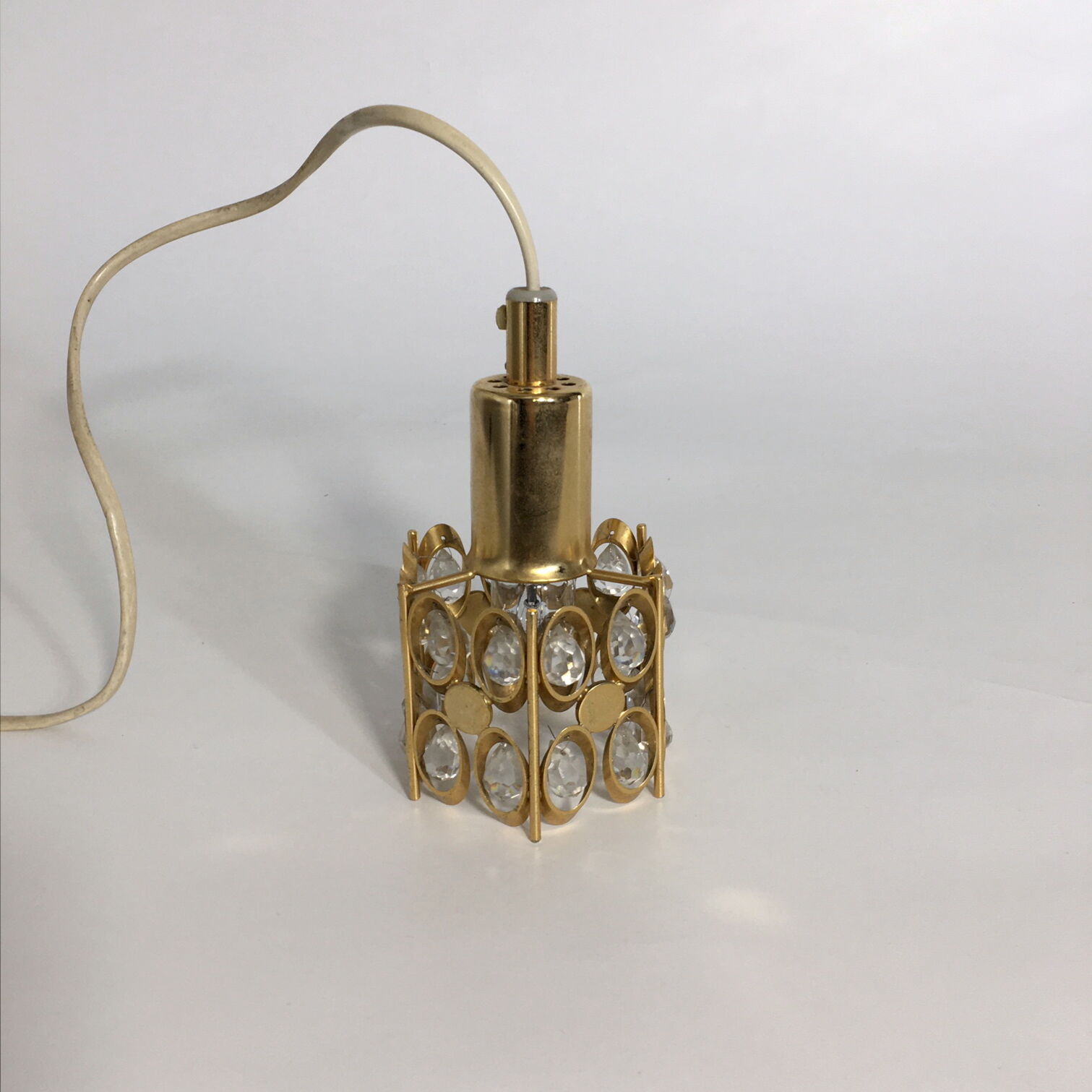 Two pendant lights in gilded brass and crystal, by Palwa, design 1960