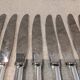 12 silver-plated table knives by Christofle America, 24.5cm