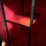 Contemporary wardrobe in black faux leather with diamond pattern and gold handles.