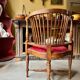 Corner armchair, dark wood and red velvet office chair.