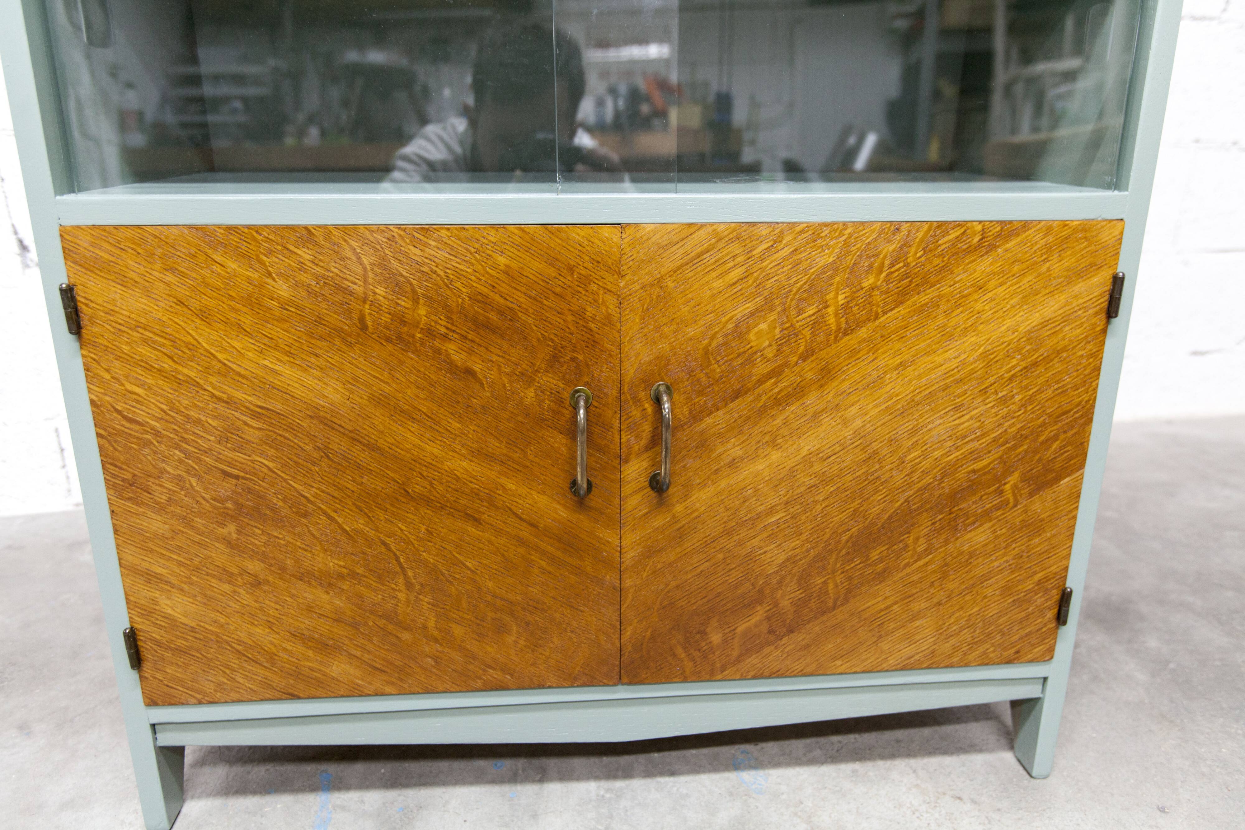 Atypical green noble 1960s low display cabinet.