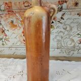 Old bottle in terracotta varnished finish